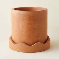 a large clay pot sitting on top of a white table