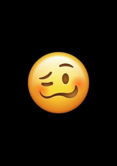 an emoticive smiley face with eyes closed on a dark black background stock photo