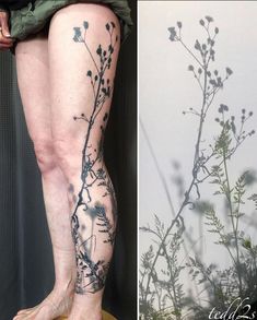 a woman's legs with flowers and leaves tattooed on them