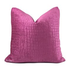 a pink pillow on a white background