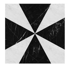 a black and white marble pattern with an inverted design in the center, on top of it