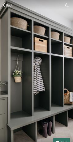 an image of a walk in closet with baskets on the shelves