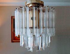 a chandelier hanging from the ceiling in a room