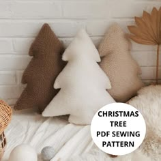 the christmas tree pattern is on display in front of some pillows and other decor items