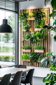 an office with plants growing on the wall