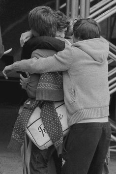 black and white photograph of children hugging each other