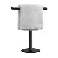 a towel rack with two white towels on it and one black towel in the middle