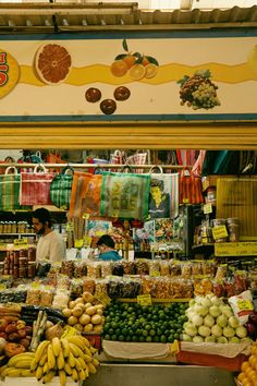 a fruit and vegetable stand in a market