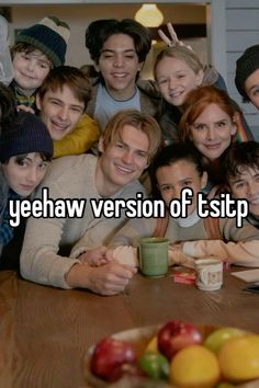 a group of people sitting around a wooden table with fruit on it and the words yeehaw version of tsip