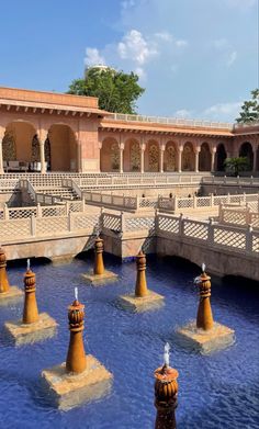 the water is blue and there are many fountains