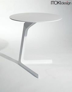 a white table sitting on top of a white floor