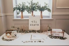 the table is set up with flowers and decorations