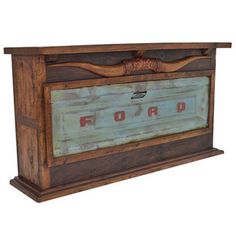 an old wooden box with the word ford painted on it's front and sides