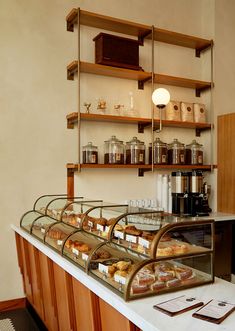 a counter with many different types of pastries on it in a store or restaurant