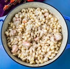 macaroni and cheese with shrimp in a blue pot