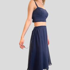 Best Seller - Tie Waist Overskirt in Indigo silk chiffon. Skirt is very versatile and can be worn over a slip, leggings, bathing suit, etc., or wear it as a slip. Pair it with one of our tops for a seamless dressed up look. Now available in Ivory, Indigo, Cloud Blue, Pistachio and Vintage Rose. One Size fits most. - princess seams - drawstring ties To prevent shrinkage, hand wash in cold water, hang to dry, or dry cleaning is recommended. Please email for additional information and before placin Summer Evening Chiffon Skirt, Silk Fitted Skirt For Daywear, Summer Wrap Skirt For Night Out, Elegant Summer Two-piece Dress With Flowy Skirt, Summer Evening Skirted Bottoms, Flowy Summer Evening Skirt, Summer Skirted Bottoms For Evening, Flowy Skirt For Summer Evenings, Silk Bottoms For Summer Night Out