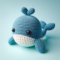 a crocheted blue whale stuffed animal