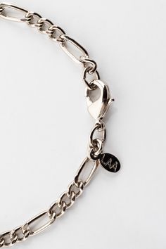 The Figaro Chain is a classic design with passionate flair due to its Italian origin. Pair this bold unisex style with the matching Figaro Bracelet JWLFB for a coordinated look. To shorten the necklace, hook the clasp directly onto one of the ovals of the chain. Please avoid contact with liquids and creams when wearing your plated jewelry. Keeping your jewelry as dry as possible will extend the life of its color and luster. | Figaro Necklace in Silver, Size 18 Snapchat Aesthetic, Figaro Bracelet, Figaro Necklace, Figaro Chains, Figaro Chain, Unisex Style, Jewelry Plate, Fashion Bracelets, Chain Bracelet