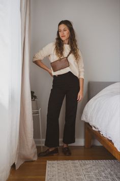 Ashley wearing a cream colored graphic sweatshirt tucked into black cropped pants with brown penny loafers and a brown leather belt bag worn over the shoulders French Fall Outfits, Parisian Fall Outfits, Casual Chic Fall Outfits, Week Of Outfits, My 2023, Outfit 2023, Capsule Wardrobe Outfits, Everyday Casual Outfits, Modest Fits