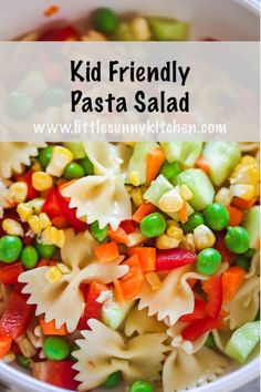 a white bowl filled with pasta and vegetables