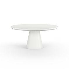 a white table sitting on top of a white floor