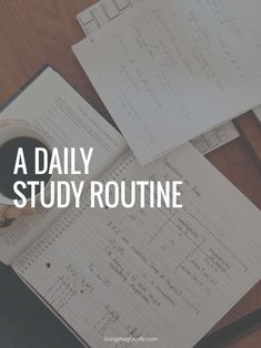 a desk topped with papers and a cup of coffee