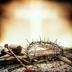 a crown of thorns on top of a wooden table