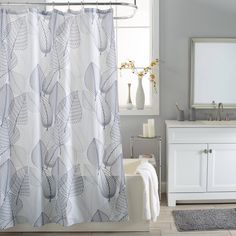 a bath room with a sink and a shower curtain