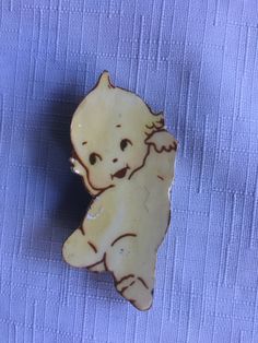 "Cupid handmade pin made of paper from the 70s, measures 2.75\". Has a little wear spot now at the very top of the head where the little curl comes up. Please take a look at my storefront at: https://www.etsy.com/shop/FabFinds42?ref=seller-platform-mcnav I have a wide selection of one-of-a-kind items, from clothing and toys to home decor and gift items, and I add new things almost every day." Movie Decor, Jacket Pins, Retro Baby, Handmade Pins, Baby Jewelry, The 70s, Gift Items, New Things, Lapel Pin