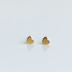 The sweetest little heart shaped stud earrings for every day. 14k yellow gold 3.5mm flat heart Minimalist Everyday Heart Earrings, Tarnish Resistant, 14k Yellow Gold Open Heart Earrings, Classic 14k Gold Heart Earrings, Everyday Minimalist Tarnish-resistant Heart Earrings, Classic Double Heart Earrings For Gifts, Minimalist Gold Hypoallergenic Heart Earrings, Yellow Gold Double Heart Earrings For Valentine's Day, Everyday 14k Gold Hypoallergenic Heart Earrings, Classic 14k Gold Heart Charm Earrings