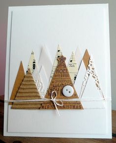 a white card with some brown and white designs on it, tied to a wooden table