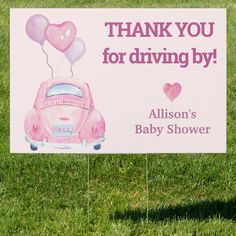 a pink car with balloons on it is for a baby shower sign that says thank you for driving by