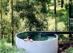 a woman is in an outdoor hot tub