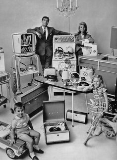 an old black and white photo of people with children