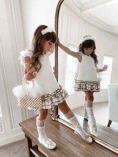 Petite Maison Kids. Made in Turkey. White couture dress with hand beading, satin back bow with a faux pearl center and gorgeous layers of ruffle skirts. Feather wings wrap around towards the back. They are soft and not detachable. Fully lined. Dry clean only. Polyester 92%, Lycra 3%, Silk 5%. 100% Cotton lining. White Couture Dress, White Couture, Ruffle Skirts, Wings Dress, Girls Dress Outfits, Kid Styles, Feather Wings, Couture Dress, White Feather