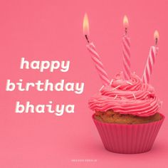 a cupcake with pink frosting and lit candles on it that says happy birthday bhajya