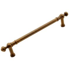 an old style brass finish pull handle on a white background