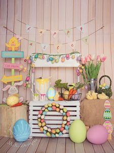 an easter display with eggs, flowers and decorations