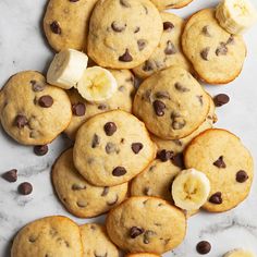 chocolate chip cookies with bananas and chocolate chips on a marble countertop, top view