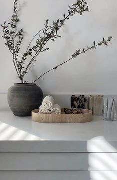 a vase sitting on top of a white counter