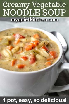 creamy vegetable noodle soup in a white bowl