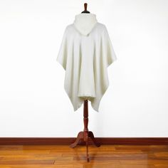 Elevate your look with our unisex poncho, meticulously handwoven by skilled artisans and crafted from plush yarn in a radiant white hue. This poncho is the epitome of comfort, promising no itchiness or irritation, making it a cozy and stylish companion.Designed for versatility, this monochrome poncho fits perfectly into every season's wardrobe. Ideal for bundling up during chilly months or acting as a breezy overlay during warmer seasons, this poncho becomes an indispensable part of any fashion White Winter Poncho Cape, White Cozy Winter Poncho, White Oversized Winter Poncho, Oversized White Poncho For Winter, Oversized White Poncho Cape, Oversized White Cape Poncho, White Oversized Winter Cape, Cozy White Winter Cape, Cozy Oversized White Poncho