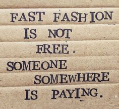 some type of cardboard sign that says fast fashion is not free, someone somewhere is paying