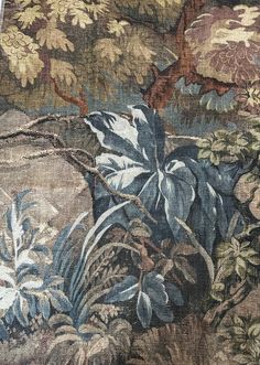 an old tapestry with plants and trees on it