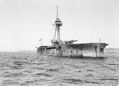 an old battleship in the middle of the ocean