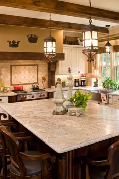 a large kitchen with an island in the middle