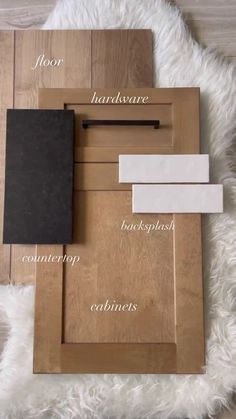 the contents of a wooden frame laying on top of a white rug