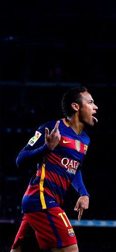 a soccer player with his mouth wide open in front of the camera, making a funny face