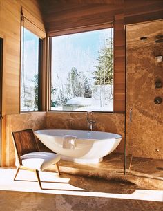 a large bath tub sitting in the middle of a bathroom