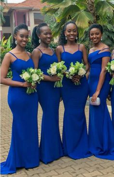 the bridesmaids are all wearing blue dresses and holding bouquets in their hands